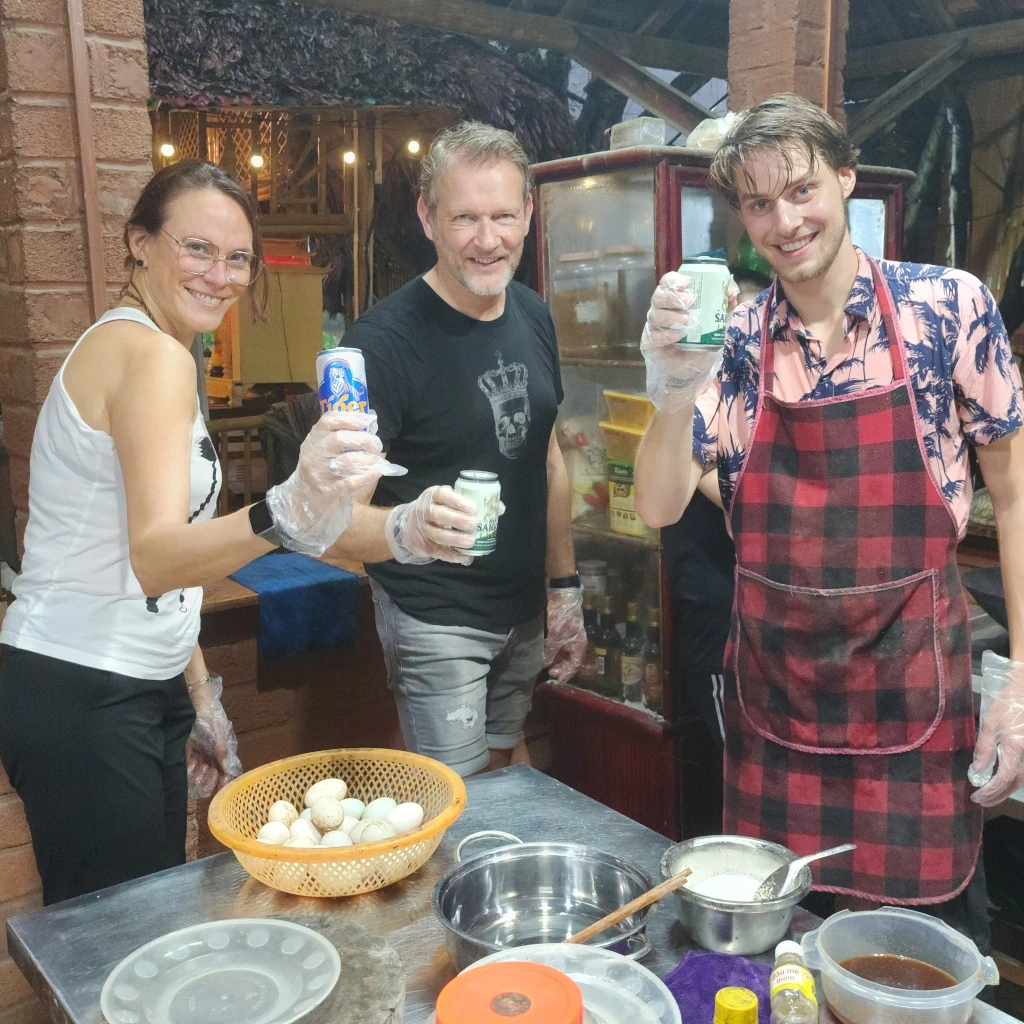 Travellers cooking together at a class in Tam Coc, Ninh Binh