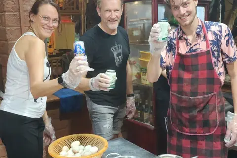Travellers enjoying a cooking class together in Tam Coc